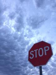 stop sign and clouds