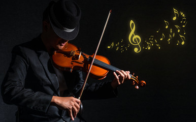 Violin player in dark studio with music notes, Musical concept