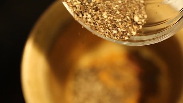 Adding Black Pepper into a Spice Grinder