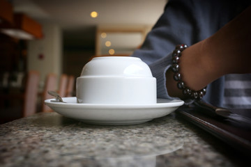 Coffee mugs has not been used on a table in a restaurant.