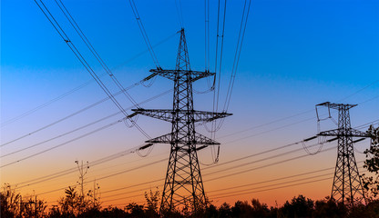 Scenery of silhouetted electrical tower during sunset