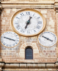 The clock on the bell and clock tower of St. John 's Co-Cathedra