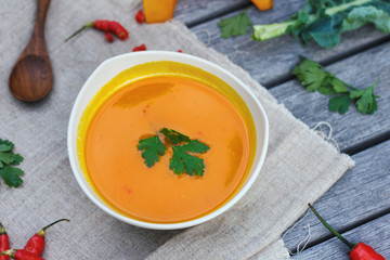 Pumpkin soup in white plate