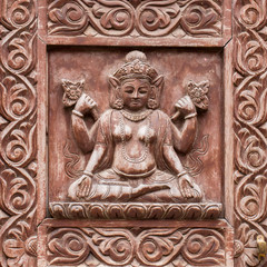 Fototapeta na wymiar Detail wooden carved door in hindu temple, Kathmandu, Nepal background. Close up