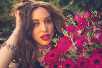 Naklejka premium Portrait of a girl with flowers.