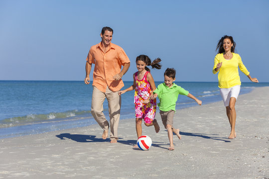 Family Playing Football Soccer On Beach