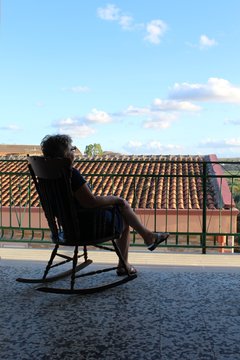 Woman On Rocking Chair