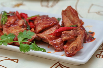 Close up of fried pork spare ribs with grilled chili curry. Selective focus.
