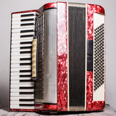 Mother of pearl accordion on a gray background
