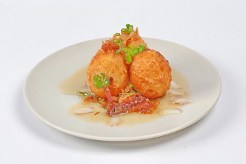 Fried hard-boiled eggs with tamarind sauce call as Khai Luk Keoi in Thai ,which mean egg gift  from son-in-law , is tasty as sweet sour and little spicy topped crispy skin of boiled egg. 