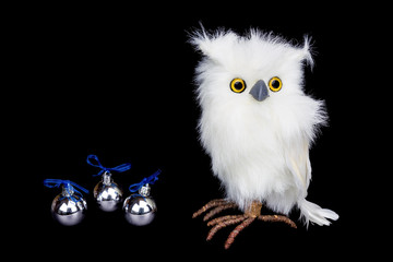 White snowy owl figurine with silver christmas balls