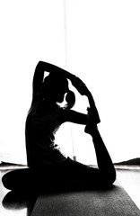 Black and white silhouette yoga woman in Absara pose