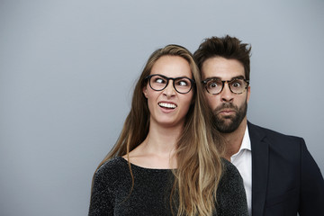 Couple pulling funny faces for camera