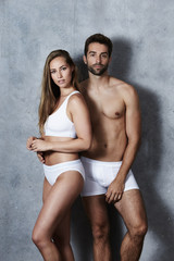 Fototapeta na wymiar Stunning couple undressed in studio