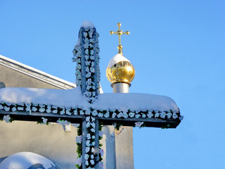 cross on the dome. Winter in the Carpathians