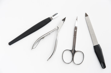 manicure instruments set on white background top view