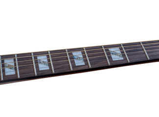 Inlay of guitur on fingerboard, selective focus, on white background