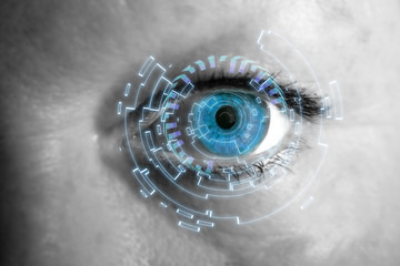 Eye of a woman with digital interface in front of it