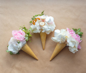 bouquets of peonies in a waffle cone on craft paper