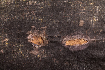 Close-up of an old canvas suitcase
