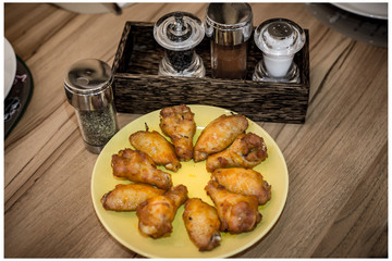 fried chicken and spices on wooden table