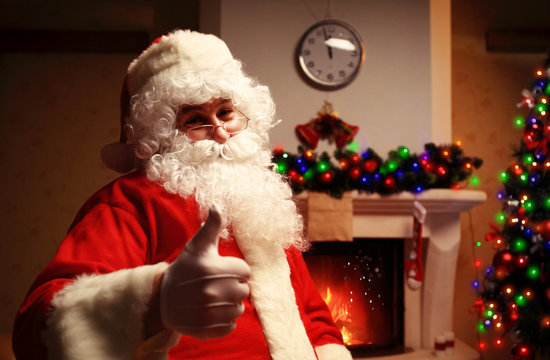 Santa Claus standing with thumbs up