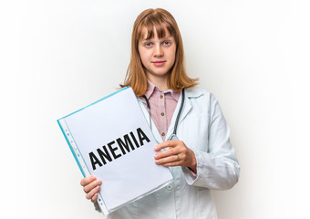 Female doctor showing clipboard with written text: Anemia