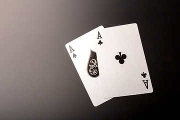 poker chips and cards on black background