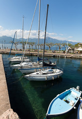 Fishing boats in the small harbor of Torri del Benaco. Garda Lake. Italy