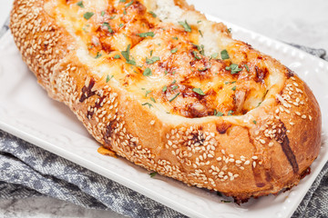 Baked fish casserole in a bread bowl