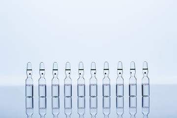 ten translucent ampoules with liquid inside