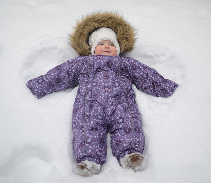 Small Baby Girl In The Snow