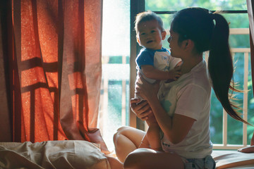 Obraz na płótnie Canvas Asian mother and her son