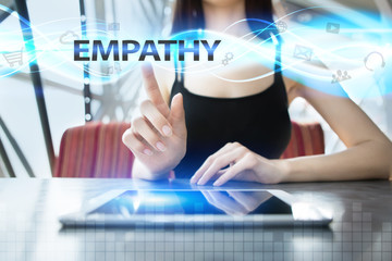 Woman is using tablet pc, pressing on virtual screen and selecting empathy