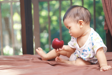 Fototapeta premium Asian baby and apple