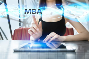 Woman is using tablet pc, pressing on virtual screen and selecting mba