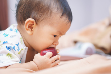 Asian baby and apple