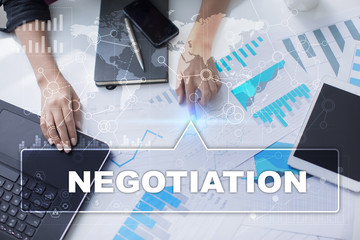 Woman is working with documents, tablet pc and notebook and selecting negotiation.