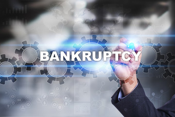 Businessman is drawing on virtual screen. bankruptcy concept.
