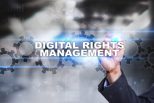 Businessman is drawing on virtual screen. digital rights management concept.