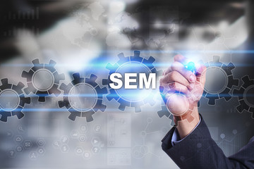 Businessman is drawing on virtual screen. sem concept.