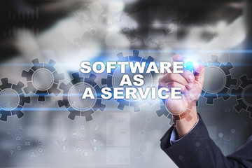 Businessman is drawing on virtual screen. software as a service concept.