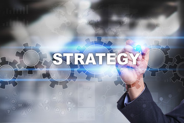Businessman is drawing on virtual screen. strategy concept.