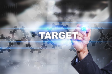 Businessman is drawing on virtual screen. target concept.