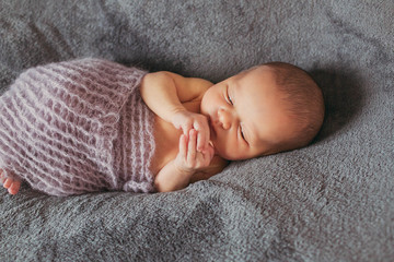 wonderful little baby lying on the bed