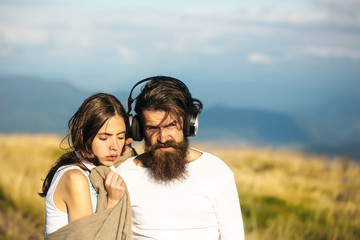Obraz premium Young couple with headphones