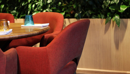Cafe interior with armchairs and glass