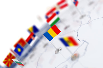 Romania flag in the focus. Europe map with countries flags