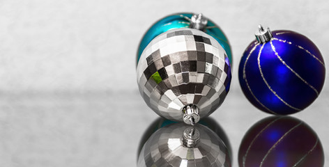 Fototapeta na wymiar The composition of blue and silver Christmas balls. New Year's t