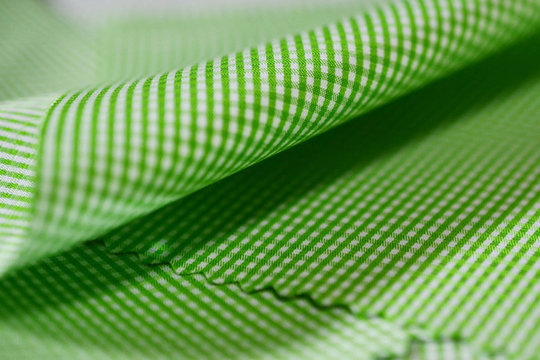 close up texture green and white scott pattern fabric of shirt